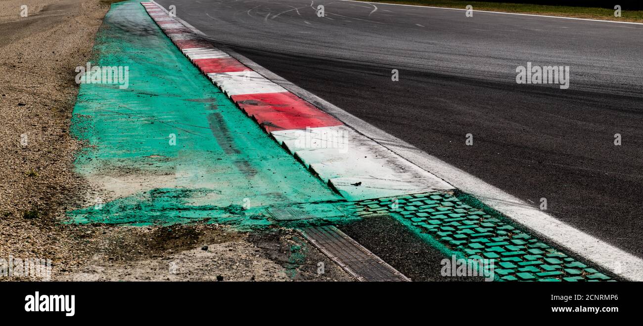 Speed concept, high angle view of asphalt racing circuit track straight white and red curb at border Stock Photo