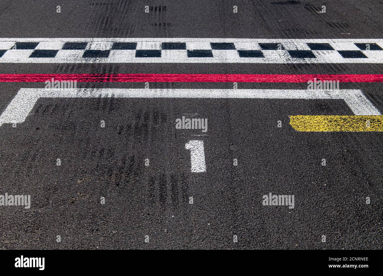 Number one close up high angle view position ranking and  checked finish line on motorsport racing asphalt track Stock Photo