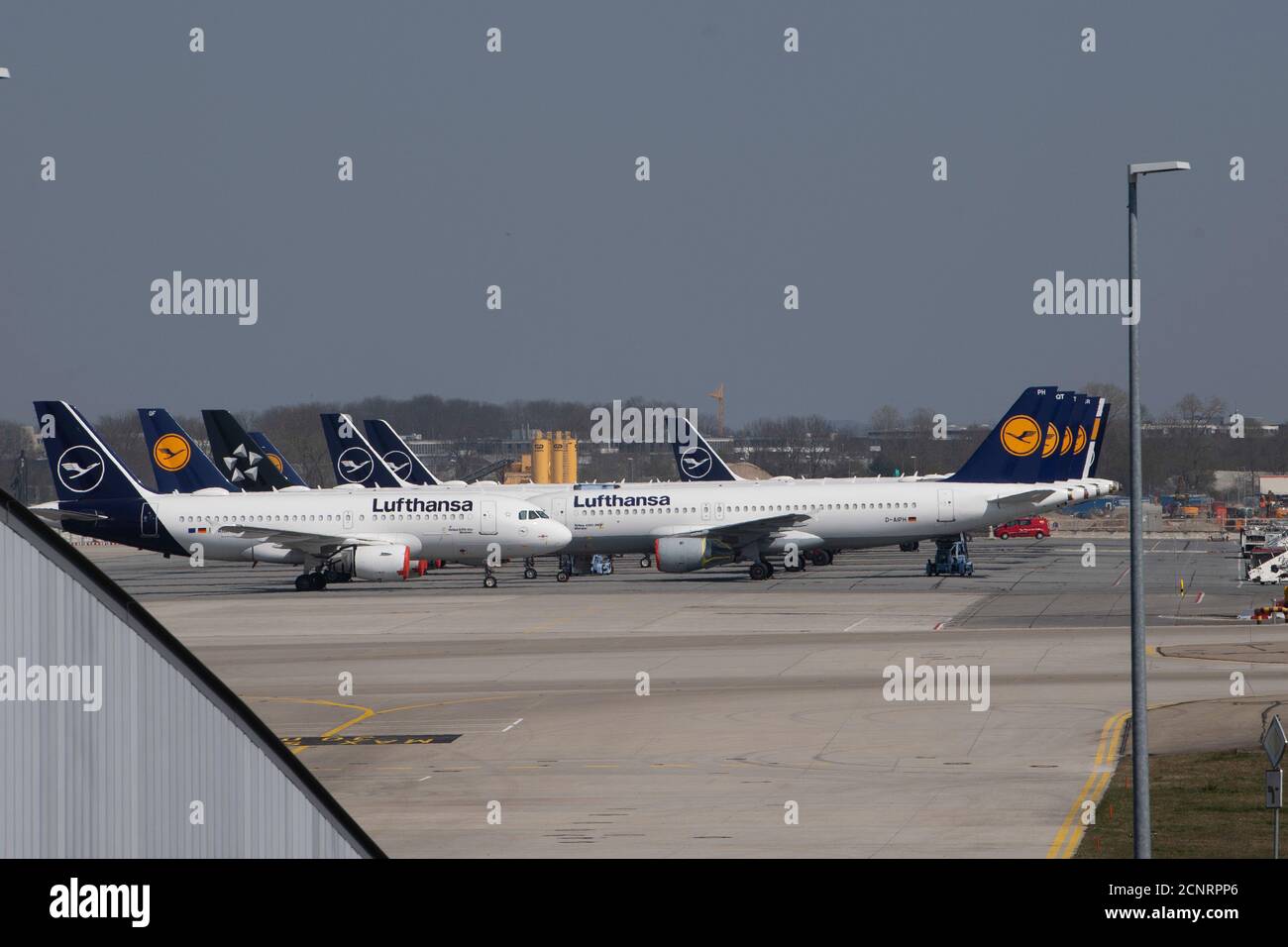 Corona pandemic, Munich Airport, Terminal 2, parked Lufthansa aircraft, parked aircraft, deserted. Stock Photo