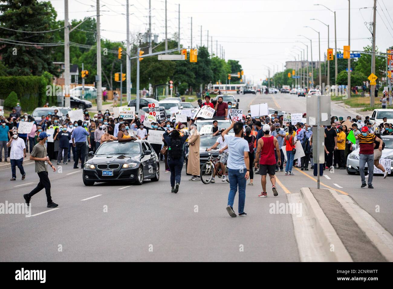 People protest against the June 20 shooting death by Peel Regional Police of Ejaz Ahmed Choudry, 62, who family members say suffered from schizophrenia in Malton, Ontario, Canada June 22, 2020. REUTERS/Carlos Osorio Stock Photo