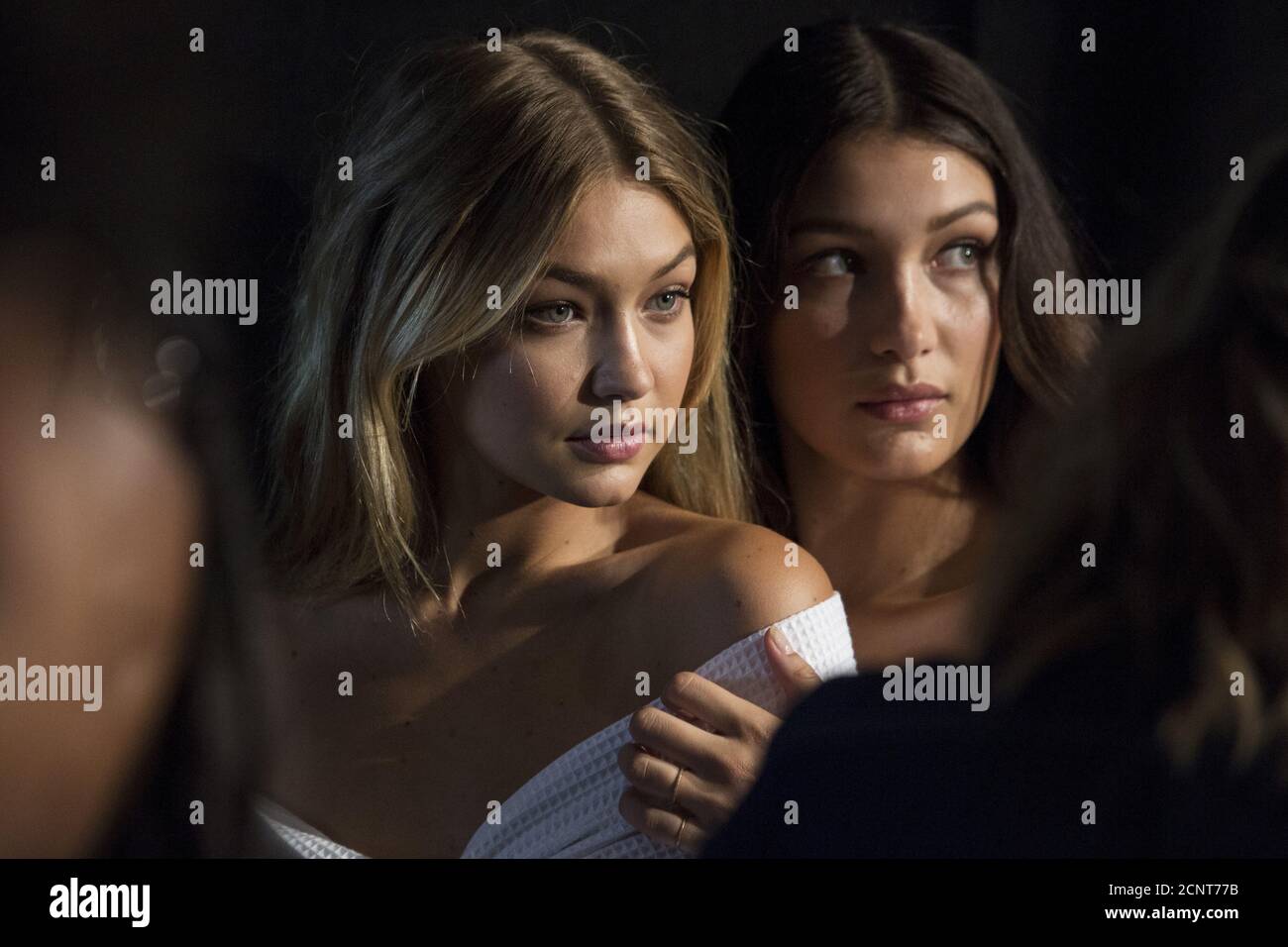 Models Gigi Hadid (L) and Bella Hadid pose for photos backstage before the Tommy  Hilfiger Spring/Summer 2016 collection presentation during New York Fashion  Week in New York, September 14, 2015. REUTERS/Andrew Kelly