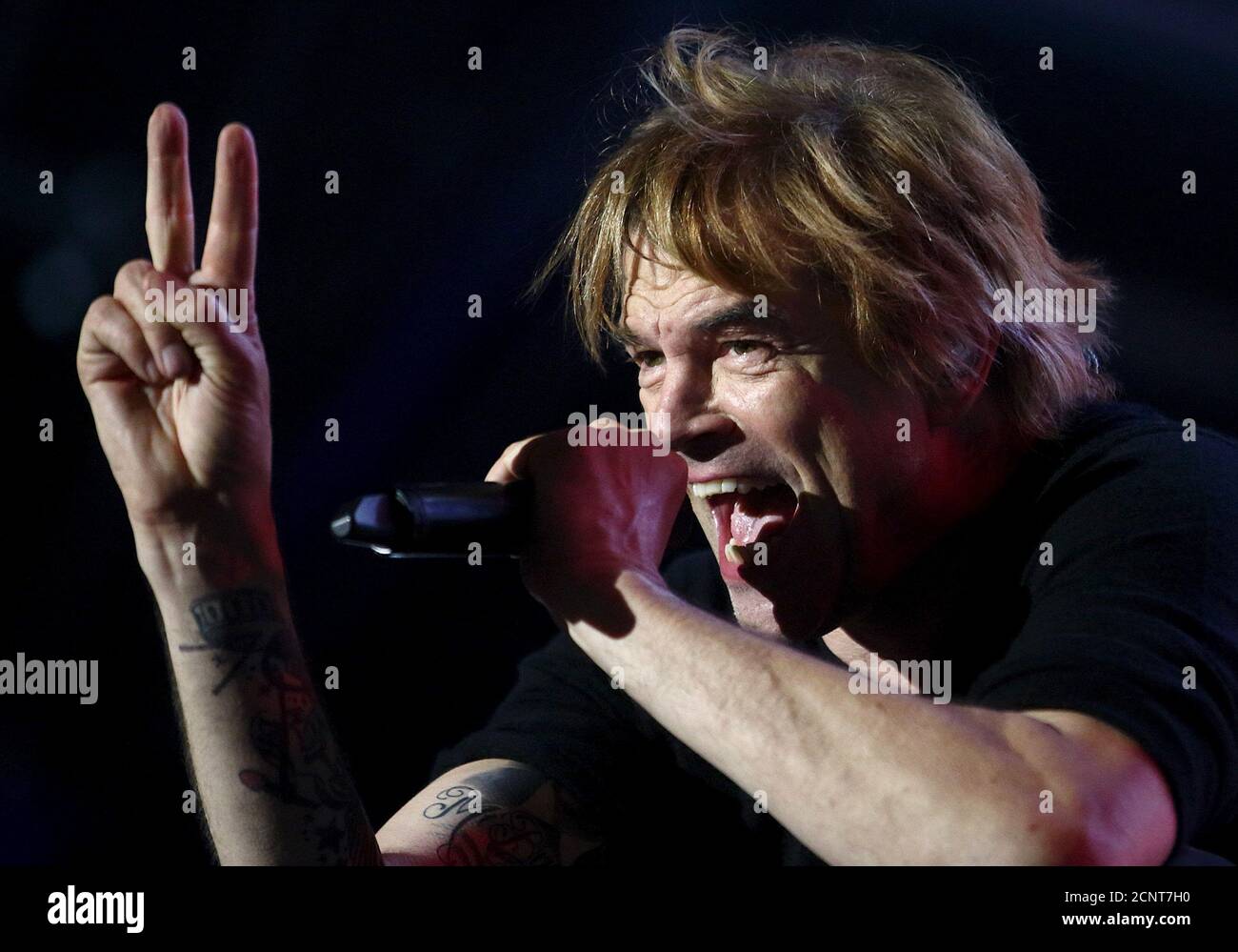 Singer Campino of German punk rock band "Die Toten Hosen" performs in front  of some 100,000 visitors, according to the organizers, during a "Voices for  Refugees" solidarity concert at Heldenplatz square in