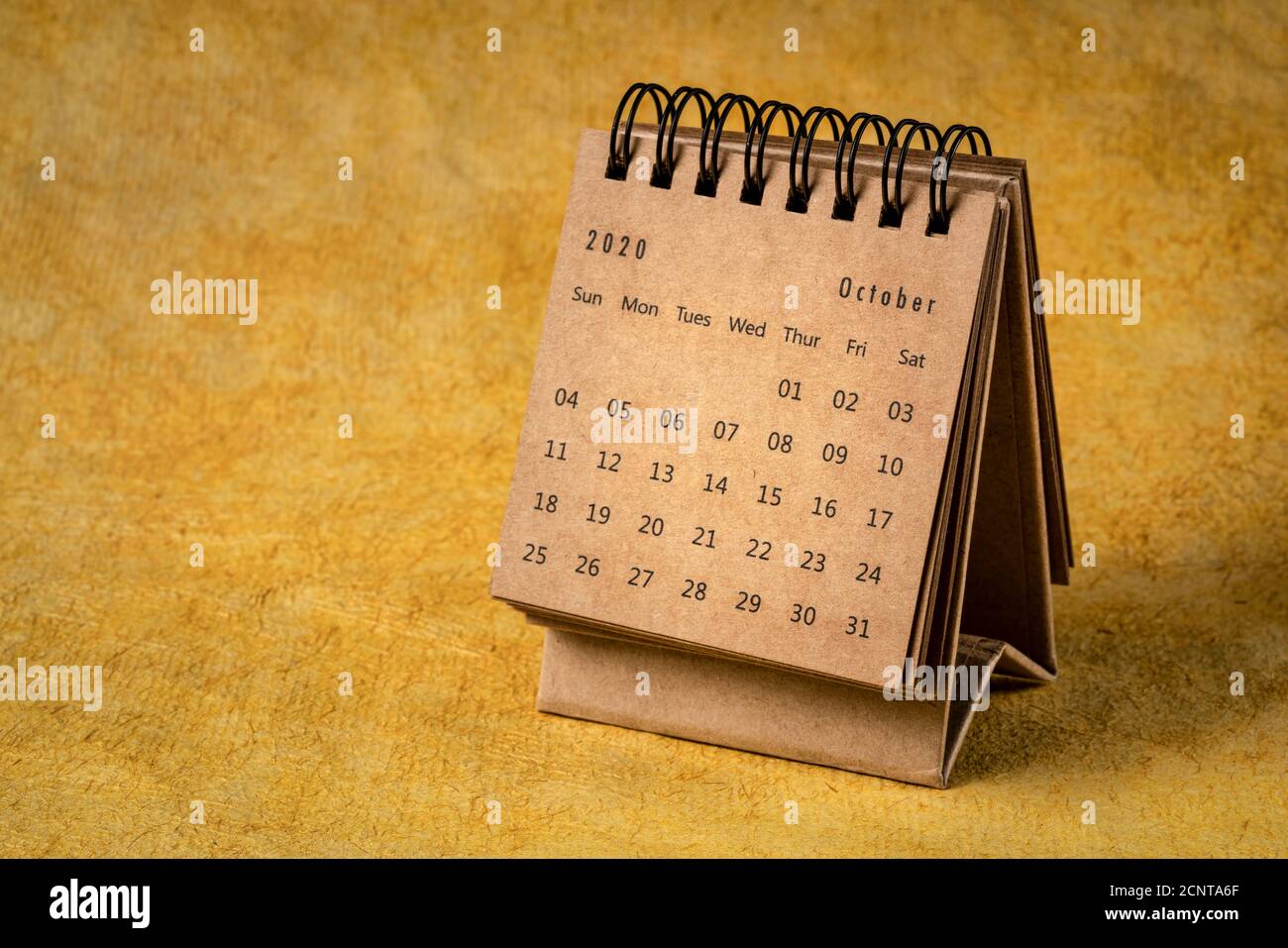 October 2020 - spiral desktop calendar on yellow handmade bark paper