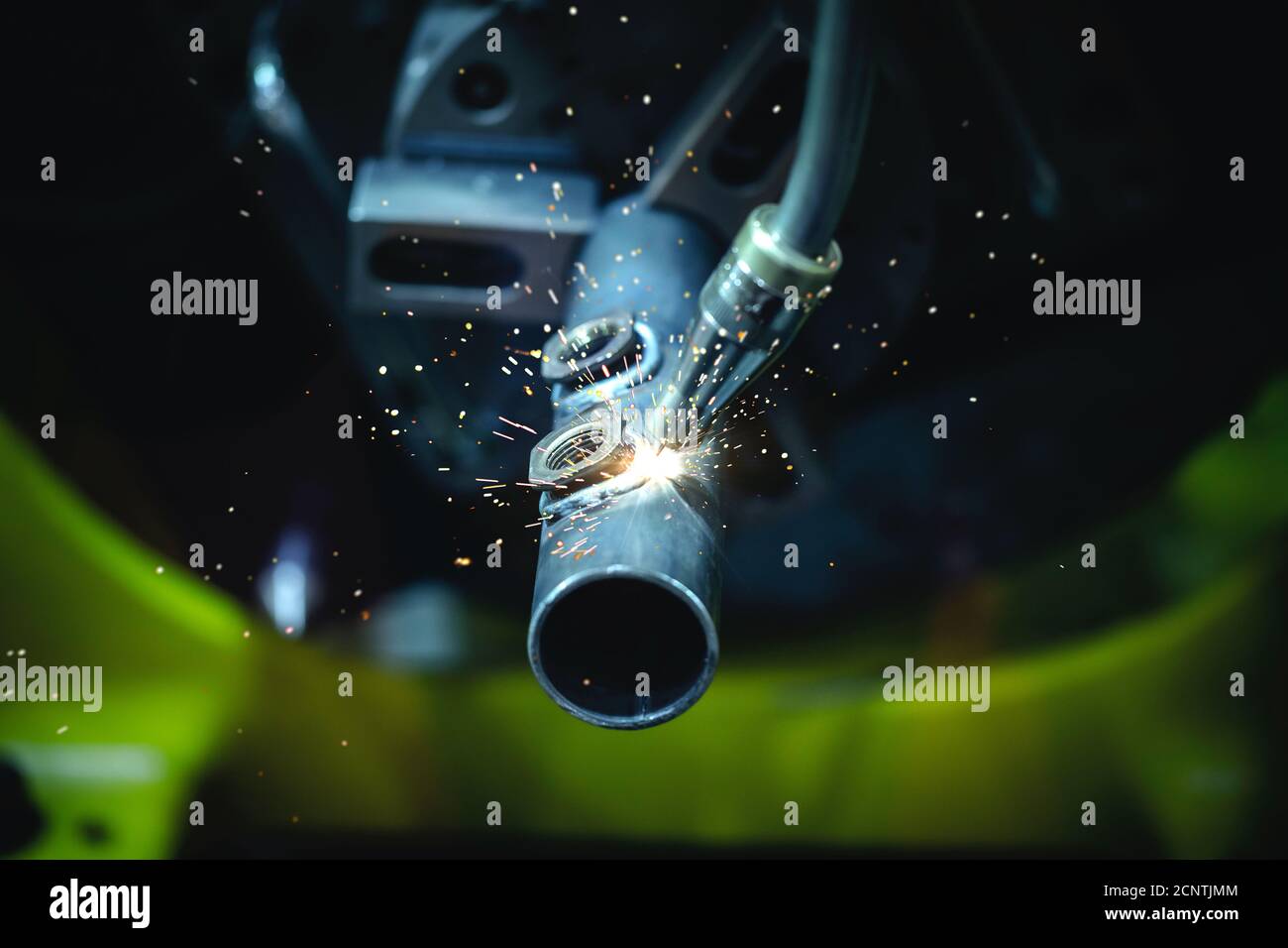 Automation robotic arm CNC machine weld and sparks the metalworking