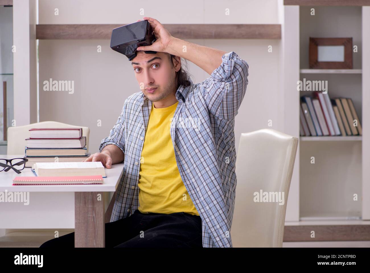 Male student preparing for exam at home Stock Photo - Alamy