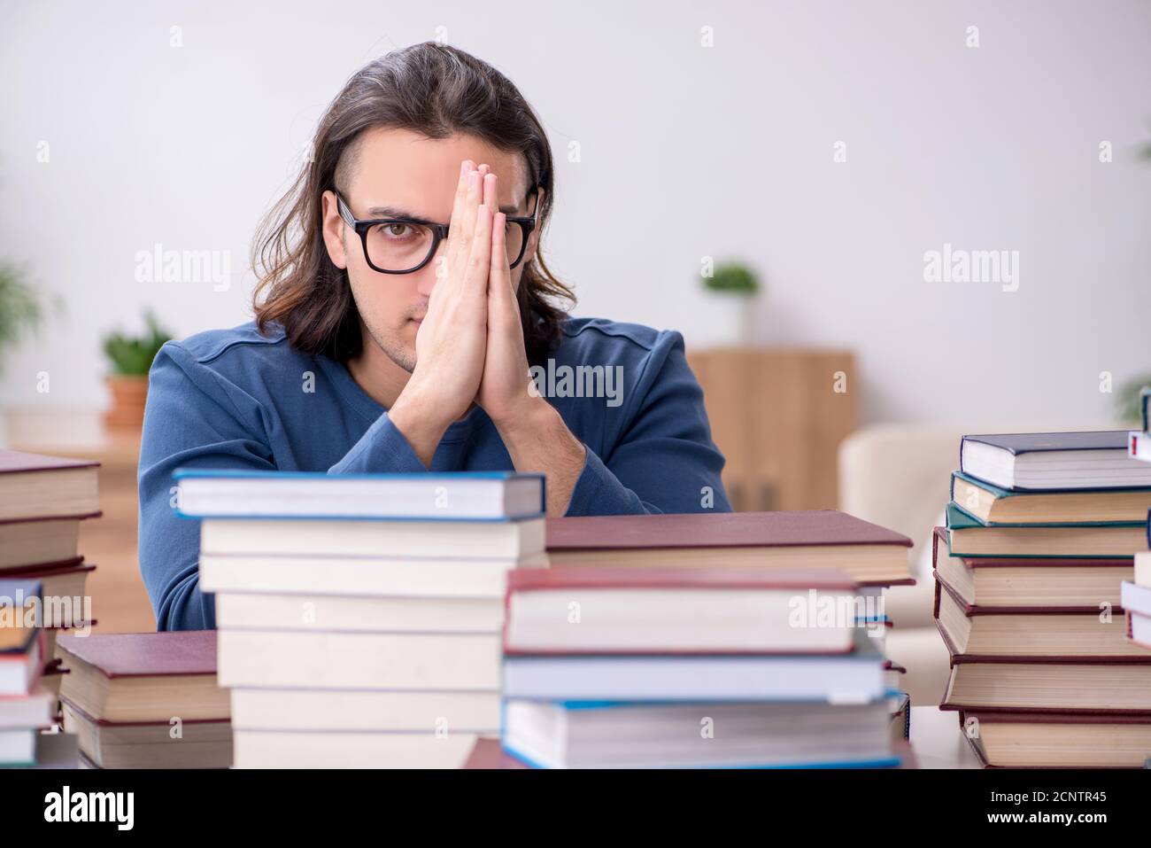 Young student preparing for exams at home Stock Photo - Alamy