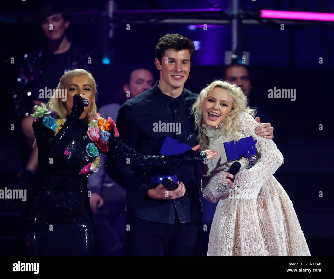 Shawn Mendes (C) and Zara Larsson (R) pose with their trophies on stage at  the 2016 MTV Europe Music Awards at the Ahoy Arena in Rotterdam,  Netherlands, November 6, 2016. REUTERS/Yves Herman