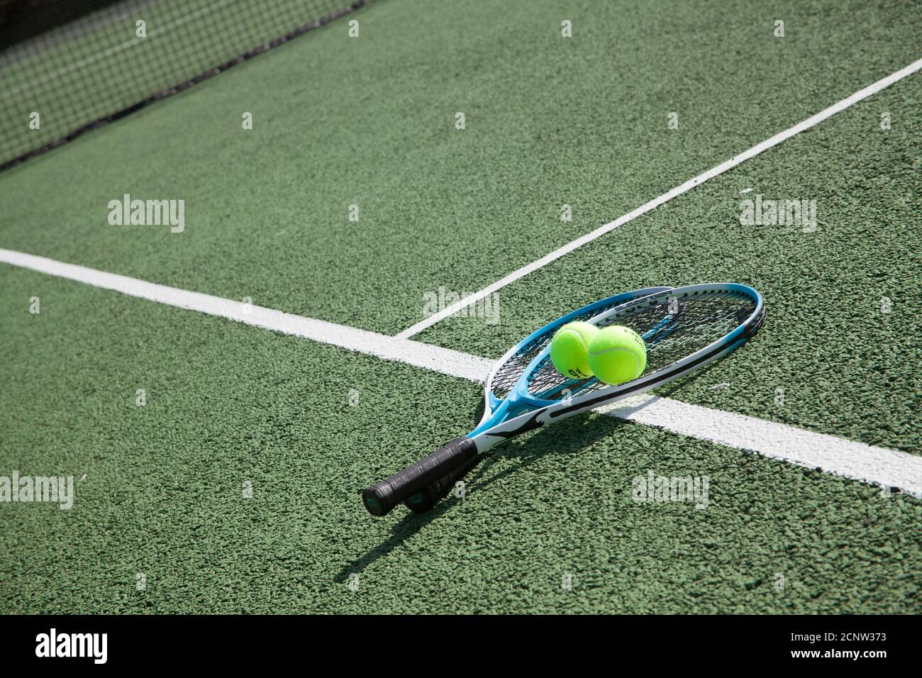 Tennis rackets on a tennis court Stock Photo
