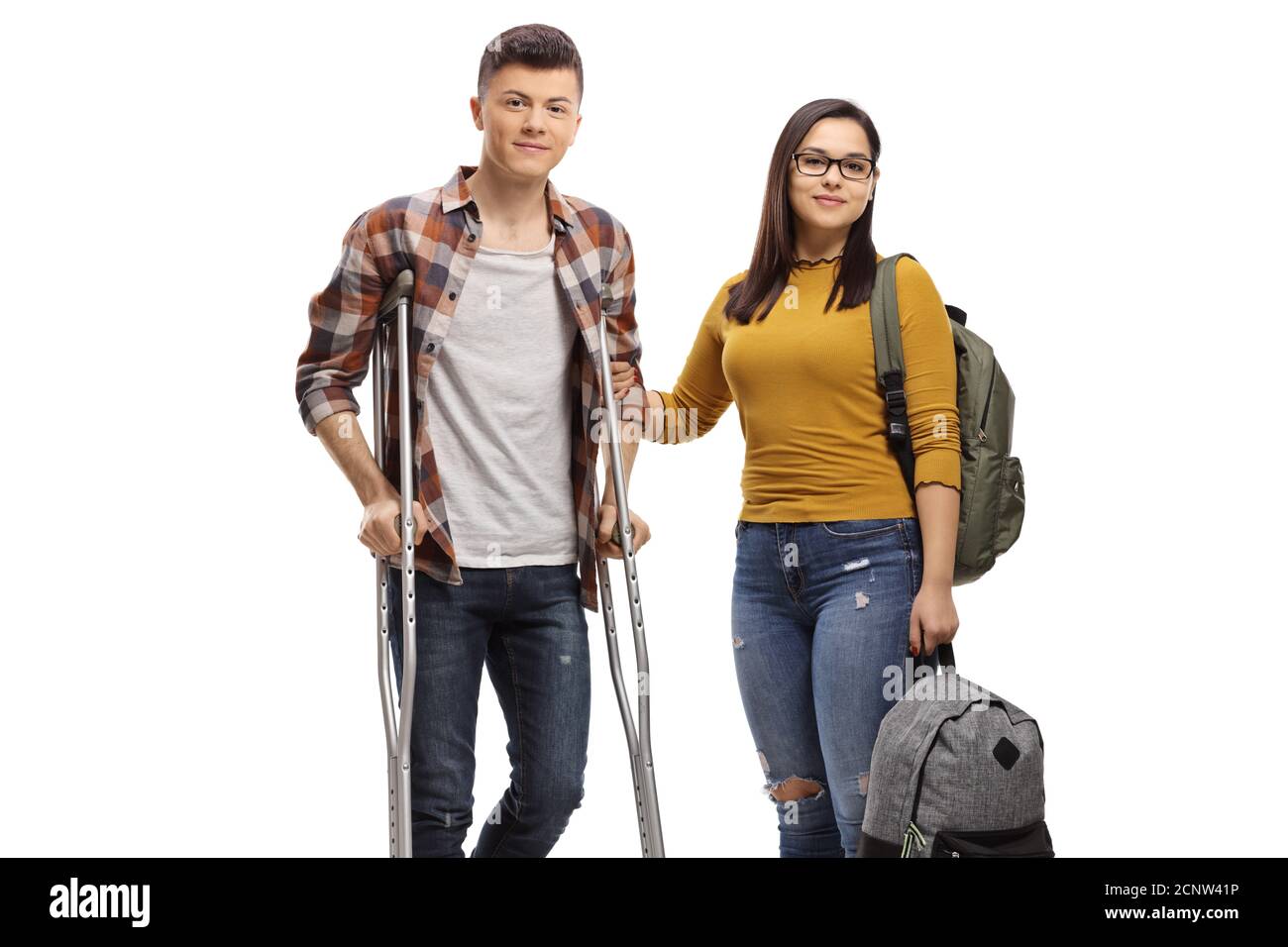 Male student with crutches and a female student helping him isolated on white background Stock Photo
