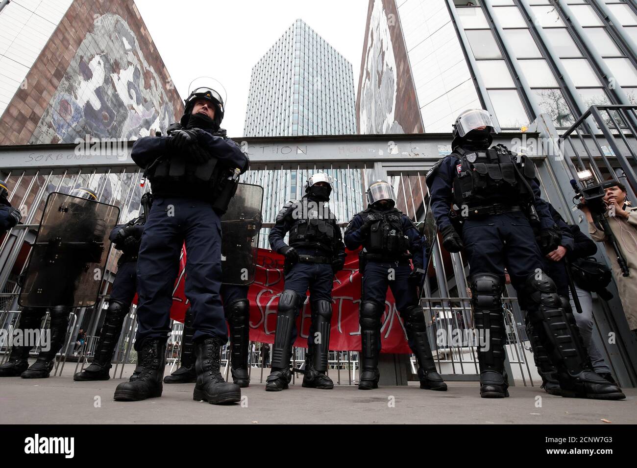 French CRS riot police secure the gate of the Jussieu campus in Paris during a protestation against Macron's university reform in Paris, France, April 10, 2018. REUTERS/Benoit Tessier Stock Photo