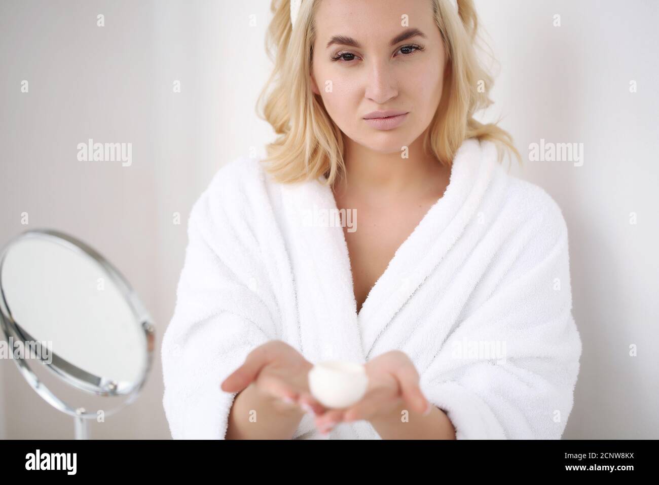 Portrait of a beautiful young woman in a bathrobe after a shower Stock Photo Alamy