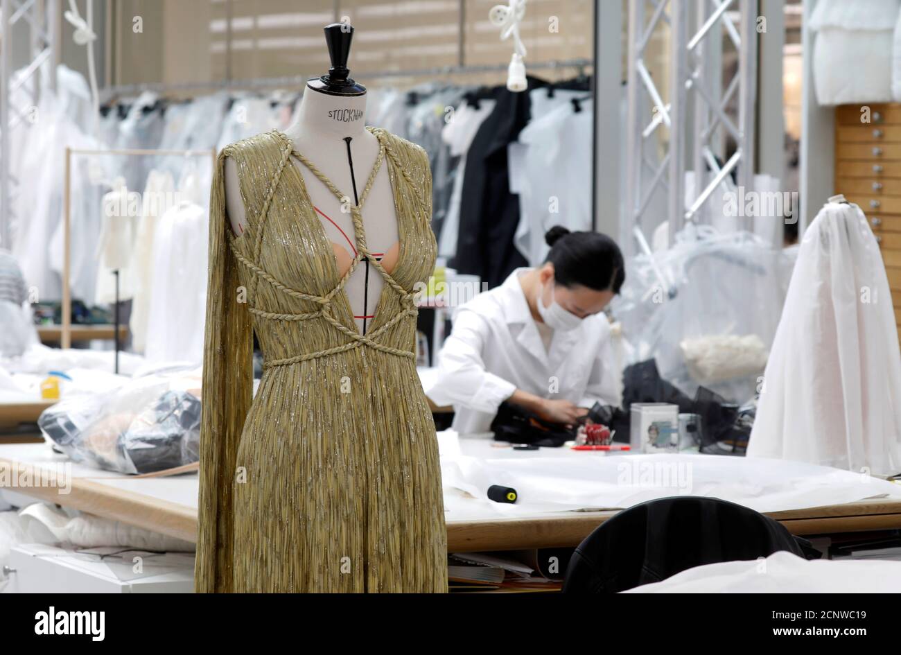 A seamstress works at Dior workshop ahead of the Haute Couture Online  Fall/Winter 2020/2021 collection presentation by designer Maria Grazia  Chiuri for fashion house Dior in Paris, France, July 4, 2020. Picture