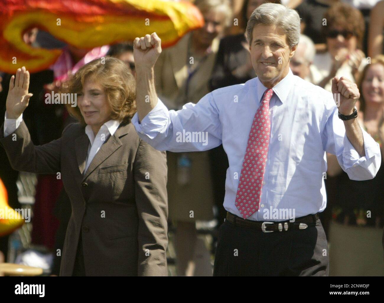 U.S. Democratic Presidential candidate, Senator John Kerry (D-Ma), pumps his fists as he arrives on stage with his wife, Teresa Heinz Kerry, to make a campaign speech at Woodrow Wilson High School in Los Angeles, May 5, 2004. REUTERS/Lucy Nicholson US ELECTION  LN Stock Photo