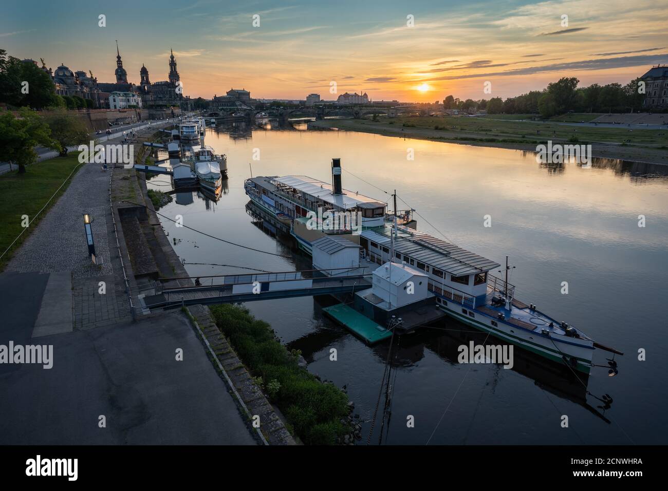 Beautiful Dresden city skyline at Elbe River and tourism pleasure steamship on pier, Dresden, Saxony, Germany. Stock Photo