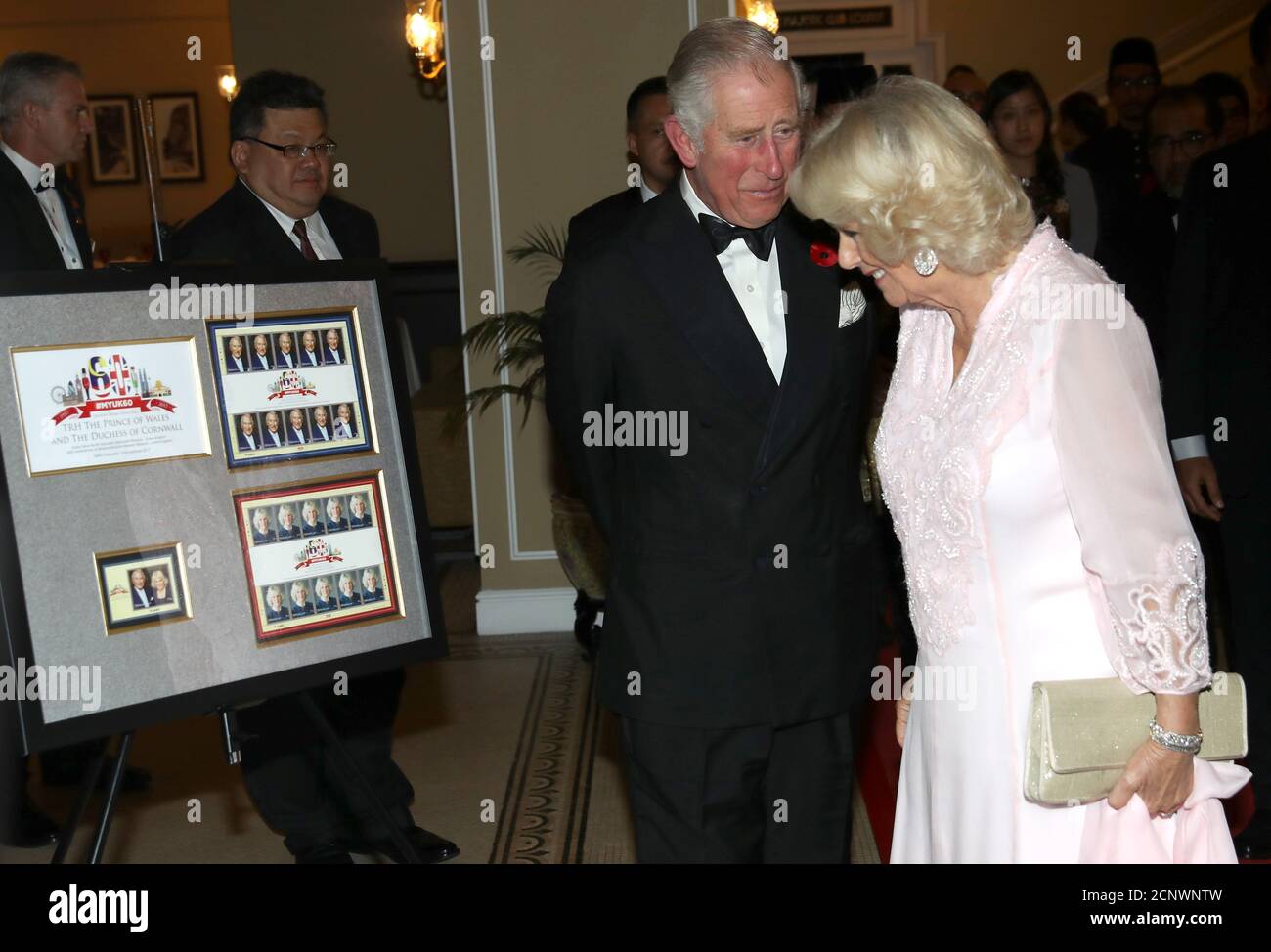 britains-prince-charles-and-camilla-duchess-of-cornwall-look-at-limited-edition-stamps-released-to-celebrate-the-60th-anniversary-of-bilateral-relations-between-the-united-kingdom-and-malaysia-ahead-of-a-gala-dinner-at-the-majestic-hotel-in-kuala-lumpur-malaysia-november-3-2017-reuterschris-jacksonpool-2CNWNTW.jpg