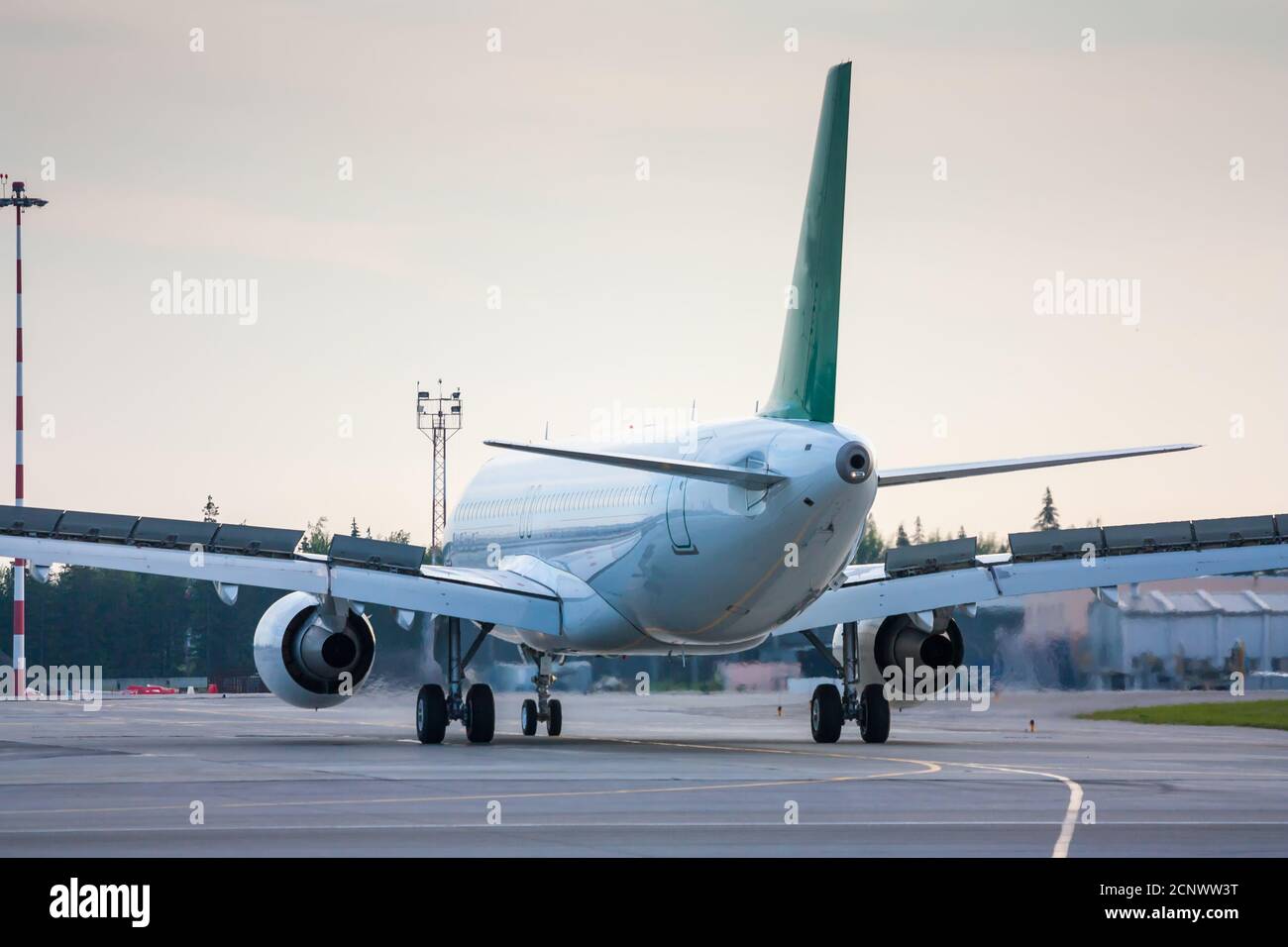 Taxiing aircraft with extended spoilers Stock Photo