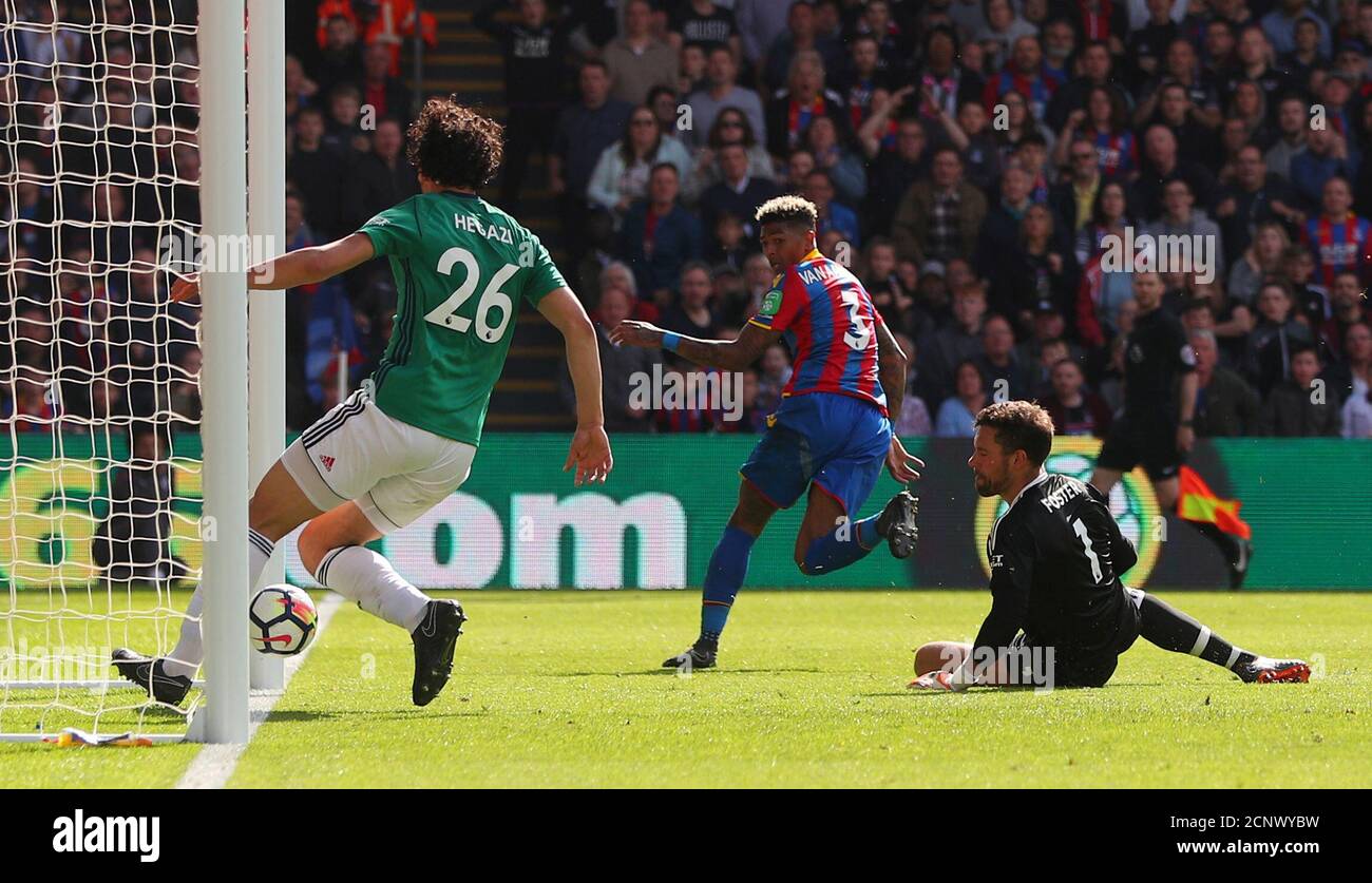 Soccer Football - Premier League - Crystal Palace vs West Bromwich Albion - Selhurst Park, London, Britain - May 13, 2018   Crystal Palace's Patrick van Aanholt scores their second goal    REUTERS/Hannah McKay    EDITORIAL USE ONLY. No use with unauthorized audio, video, data, fixture lists, club/league logos or 'live' services. Online in-match use limited to 75 images, no video emulation. No use in betting, games or single club/league/player publications.  Please contact your account representative for further details. Stock Photo