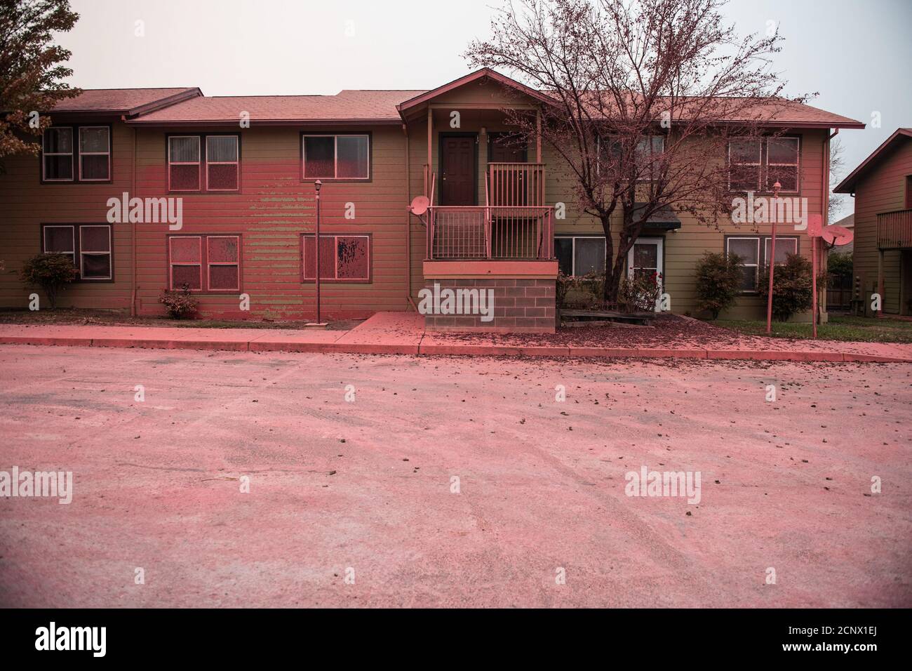 TALENT, ORE - SEPTEMBER 18, 2020: A general view of the Anderson Vista Apartments which were sprayed with fire retardent during the Almeda Fire. The town of Talent, Oregon, showing the burned out homes, cars and rubble left behind. In Talent, about 20 miles north of the California border, homes were charred beyond recognition. Across the western US, at least 87 wildfires are burning, according to the National Interagency Fire Center. They've torched more than 4.7 million acres -- more than six times the area of Rhode Island. Credit: Chris Tuite/imageSPACE Stock Photo