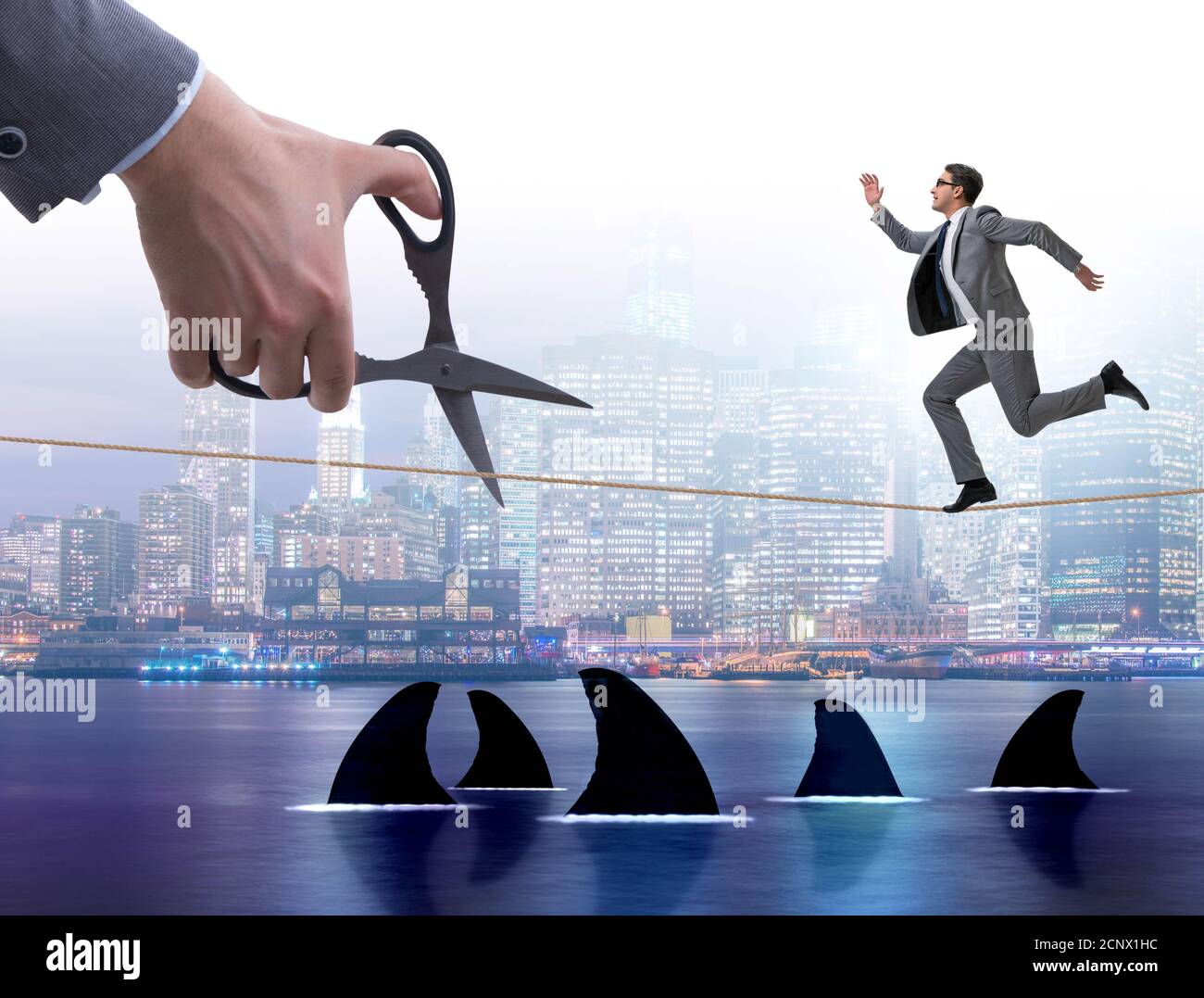 Hand cutting rope in business risk concept Stock Photo - Alamy