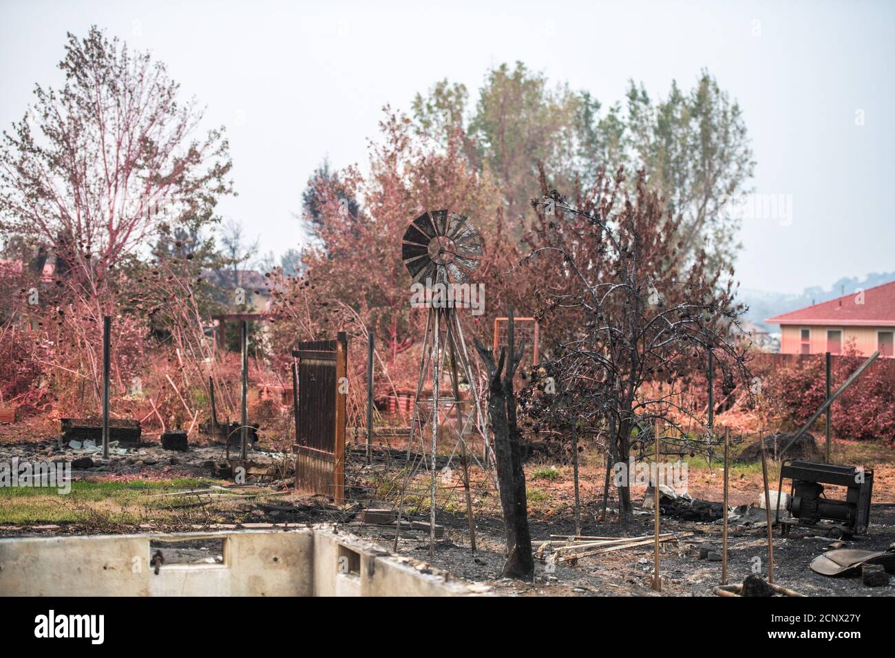 TALENT, ORE - SEPTEMBER 18, 2020: A general view of the Talent Mobile Estates #81 which were sprayed with fire retardent during the Almeda Fire. The town of Talent, Oregon, showing the burned out homes, cars and rubble left behind. In Talent, about 20 miles north of the California border, homes were charred beyond recognition. Across the western US, at least 87 wildfires are burning, according to the National Interagency Fire Center. They've torched more than 4.7 million acres -- more than six times the area of Rhode Island. Credit: Chris Tuite/imageSPACE Stock Photo