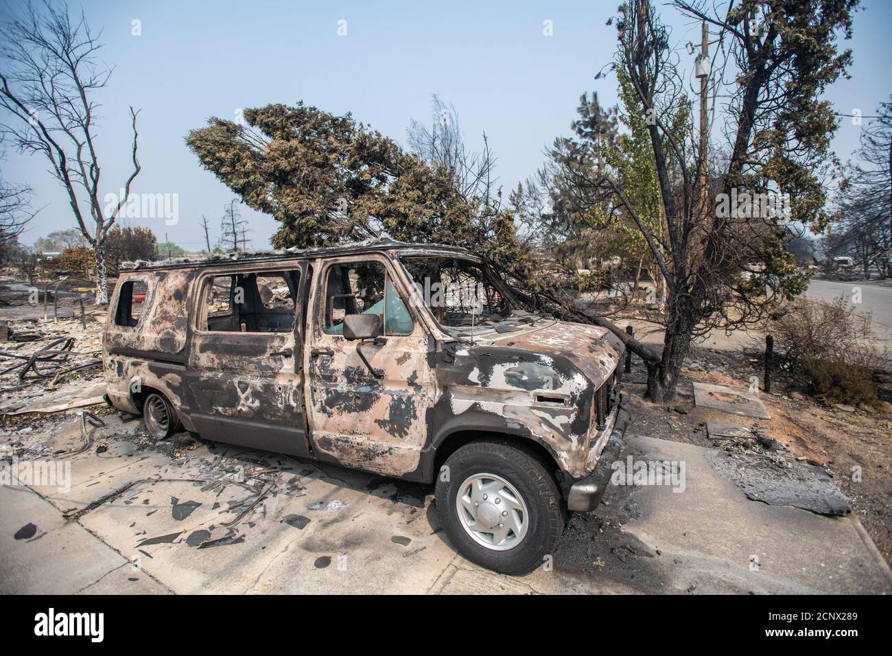 TALENT, ORE - SEPTEMBER 18, 2020: A general view of a burned out vehicle amid the aftermath of the Almeda Fire. The town of Talent, Oregon, showing the burned out homes, cars and rubble left behind. In Talent, about 20 miles north of the California border, homes were charred beyond recognition. Across the western US, at least 87 wildfires are burning, according to the National Interagency Fire Center. They've torched more than 4.7 million acres -- more than six times the area of Rhode Island. Credit: Chris Tuite/imageSPACE Stock Photo