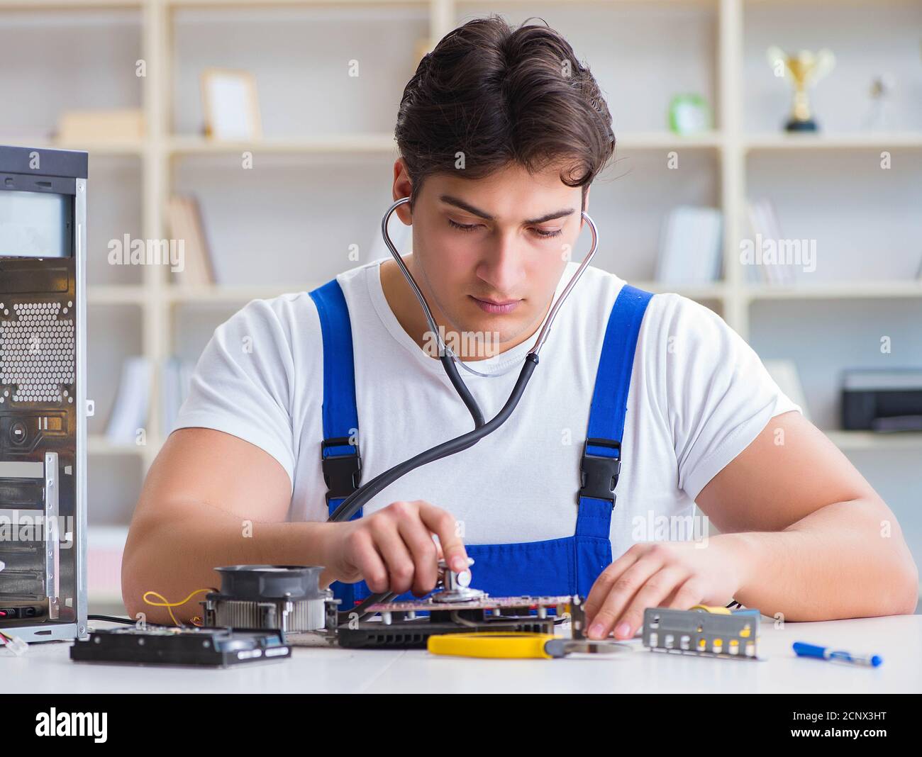 Computer repairman repairing desktop computer Stock Photo - Alamy