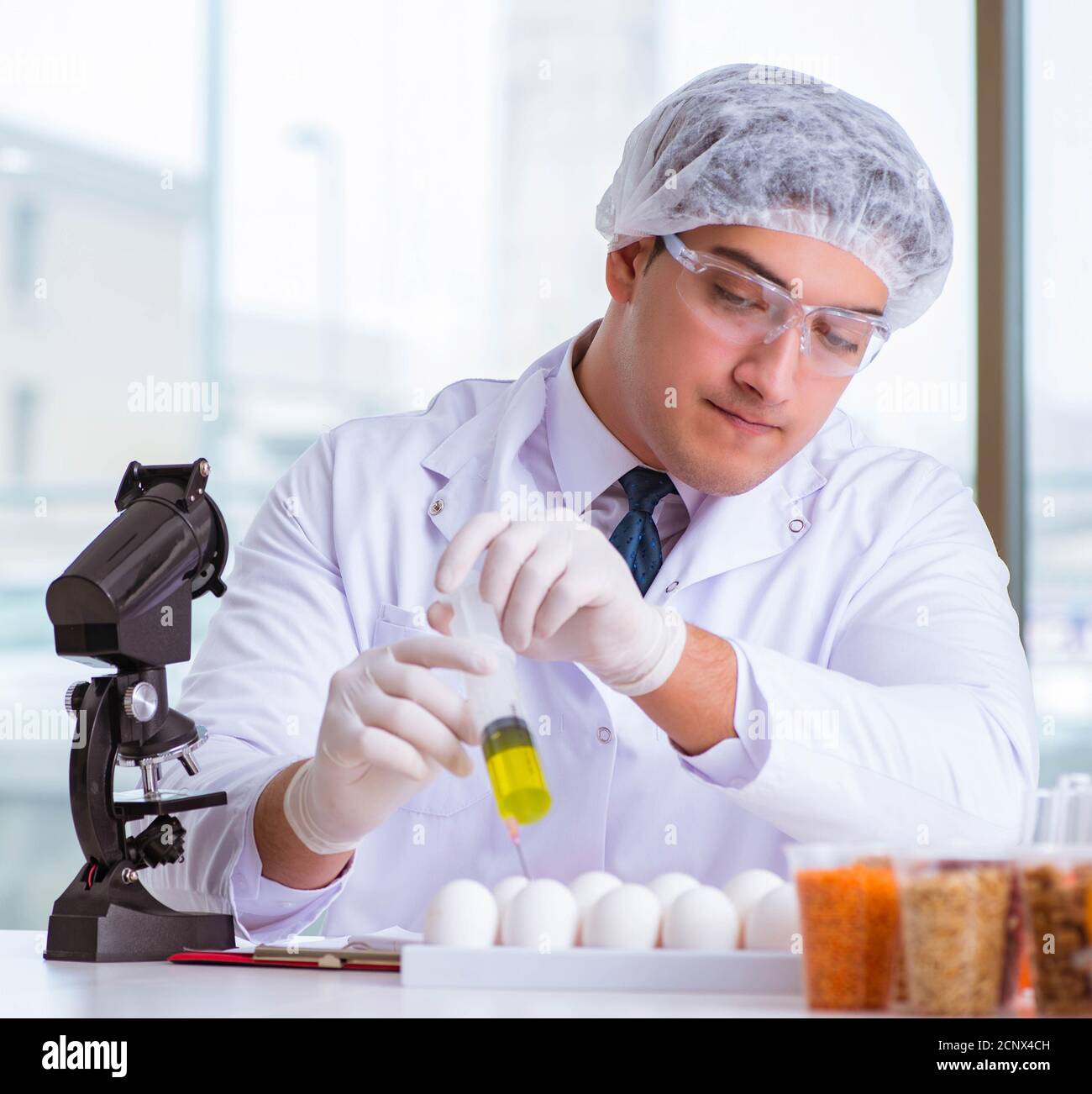 Nutrition expert testing food products in lab Stock Photo - Alamy