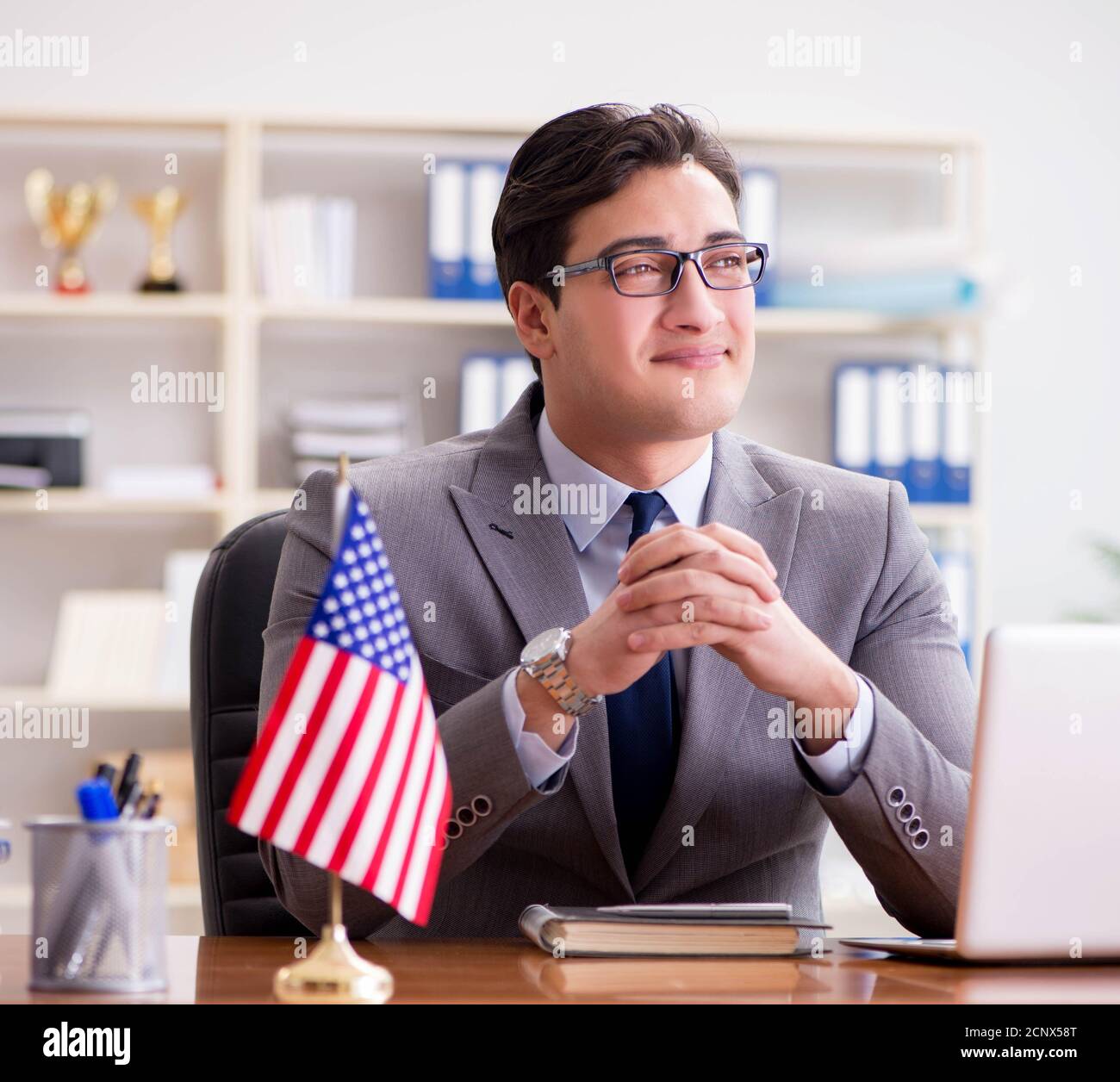The businessman with american flag in office Stock Photo - Alamy