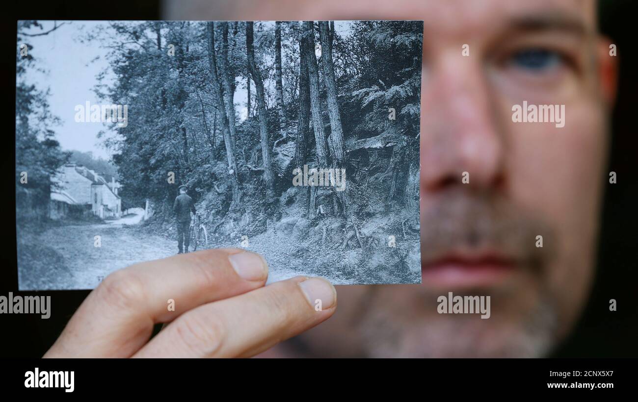 Researcher Wouter van der Veen, scientific director at the Institut Van Gogh,  shows a copy of the postcard (around 1905-1910) that enabled him to  identify the location that inspired Dutch painter Vincent