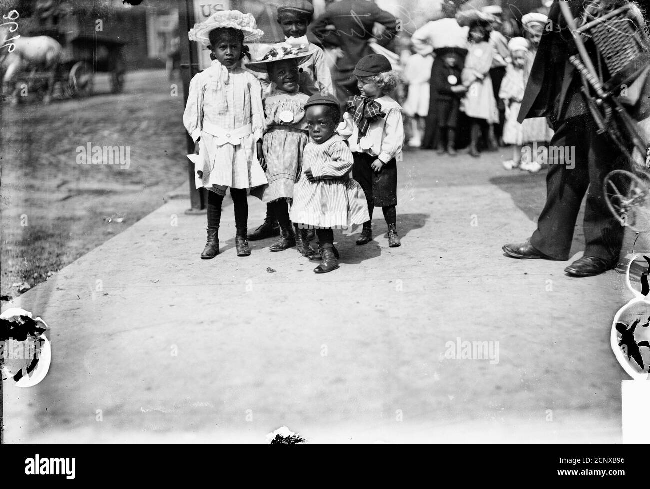 Five children with disabilities gathered on a city sidewalk during a Chicago Daily News Fresh-Air Fund outing, Chicago, Illinois Stock Photo
