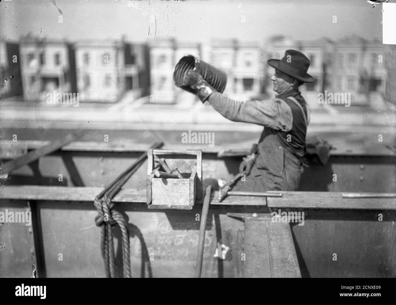 Man sitting on the scaffolding of an elevated train track under construction on the Ravenswood line, Chicago, Illinois Stock Photo