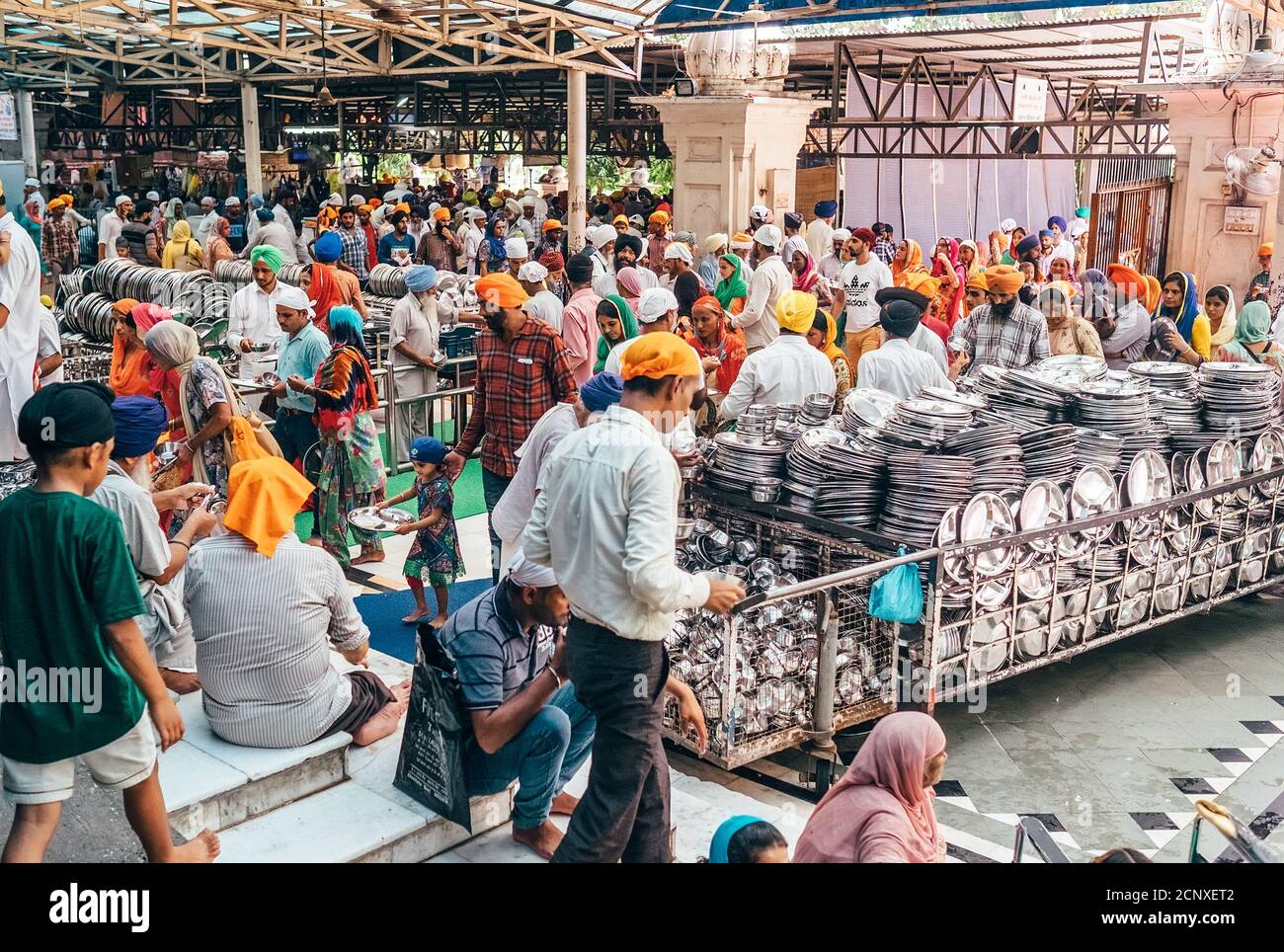 Amritsar, India – August 15, 2016: Pilgrims People come in and out Free canteen in Amritsar. This is the biggest free eatery in the world in Golden Te Stock Photo