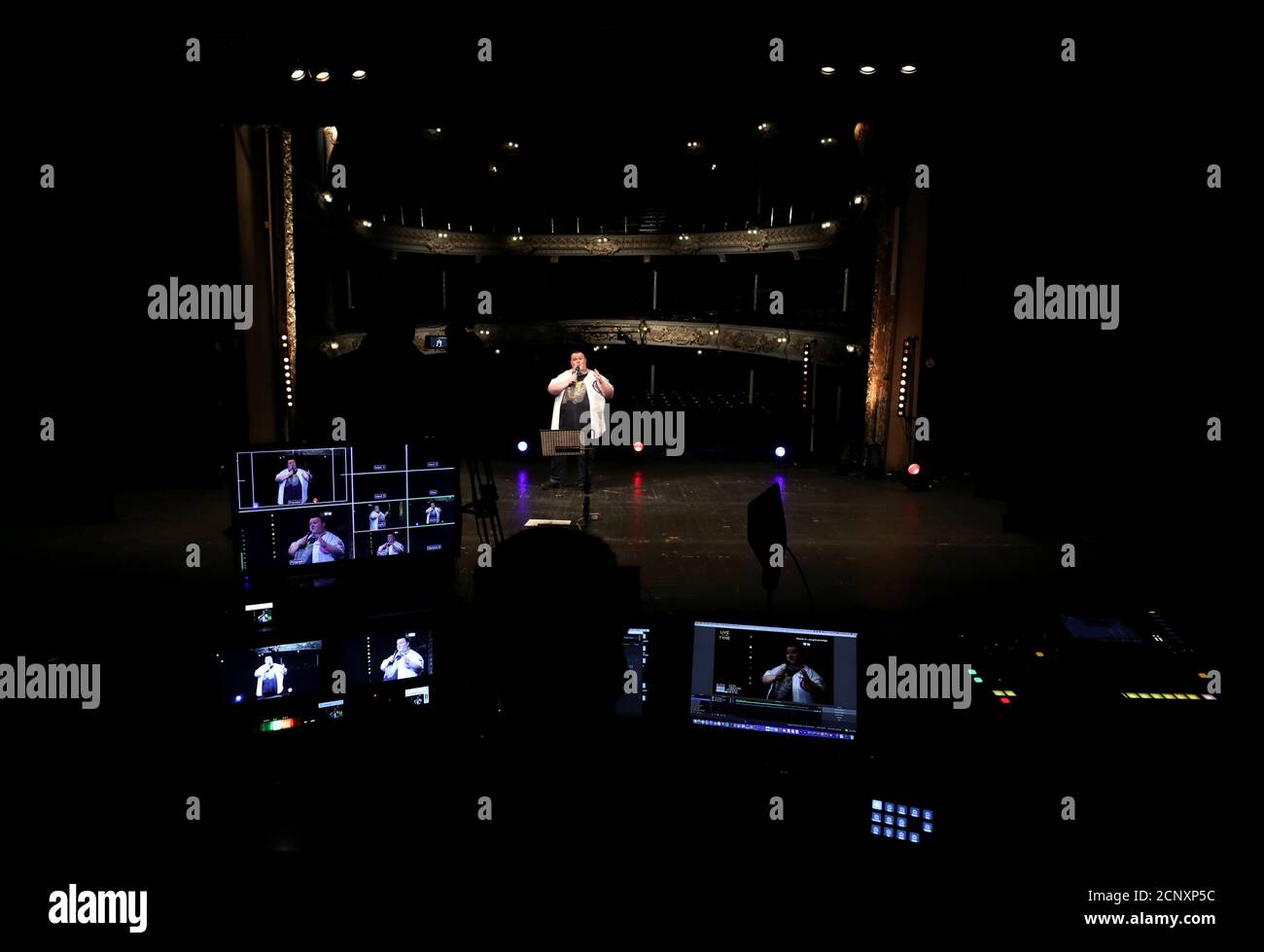 A comedian performs during the 'Live at the Tyne: An Evening of Comedy' show, streamed online from the Tyne Theatre & Opera House, following the coronavirus disease (COVID-19) outbreak, in Newcastle-upon-Tyne, Britain, July 3, 2020. REUTERS/Lee Smith REFILE - CORRECTING EVENT Stock Photo