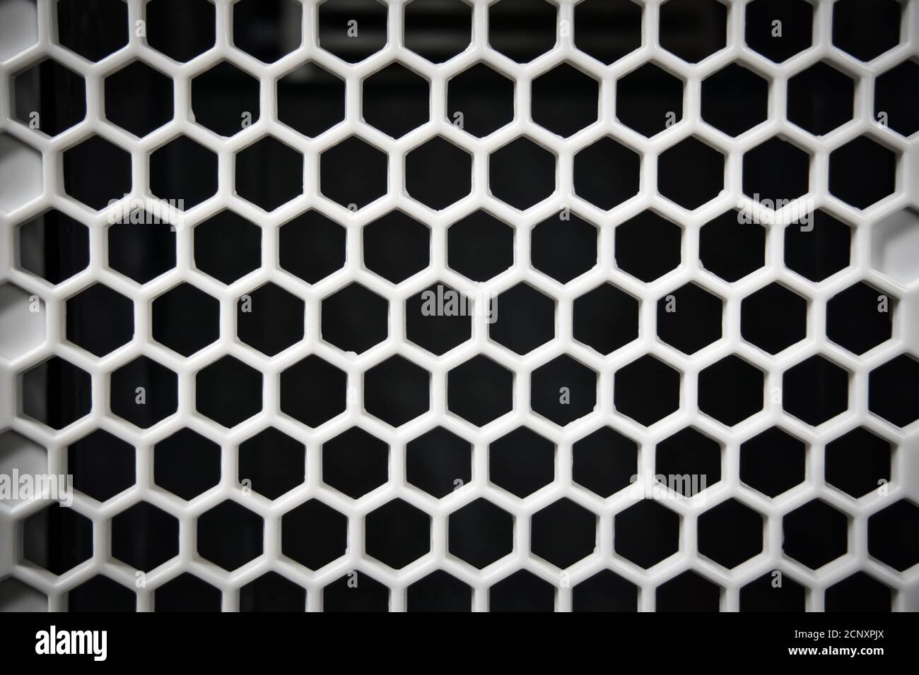 black and white plastic hexagon, honeycomb background Stock Photo - Alamy