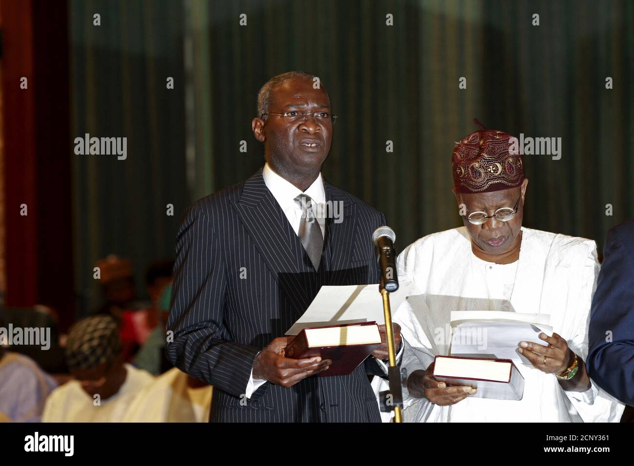 Nigeria S New Power Works And Housing Minister Babatunde Fashola Front L And New Information Minister Lai Mohammed Take Their Oath Of Office During The Swearing In Ceremony In Abuja Nigeria November 11 2015