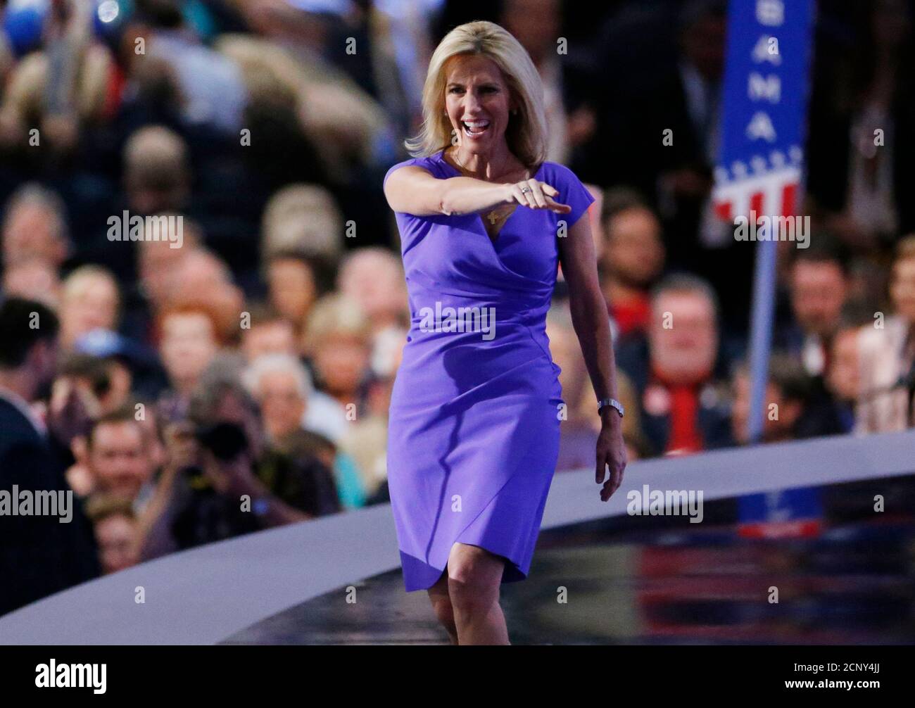 Political commentator Laura Ingraham waves as she walks onto the stage during the third day of the Republican National Convention in Cleveland, Ohio, U.S., July 20, 2016.    REUTERS/Carlo Allegri Stock Photo