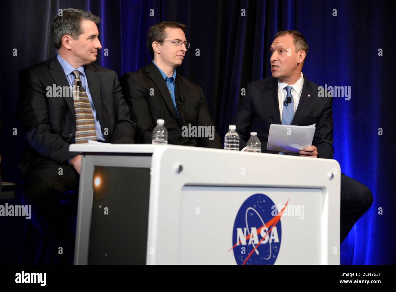 Associate Administrator for NASA's Science Mission Directorate Thomas Zurbuchen (R) makes remarks as University of Liege (Belgium) astronomer Michael Gillon (C) and Sean Carey of NASA's Spitzer Science Center listen during a news conference to present new findings on exoplanets, planets that orbit stars other than Earth's sun, in Washington, U.S., February 22, 2017. REUTERS/Mike Theiler Stock Photo