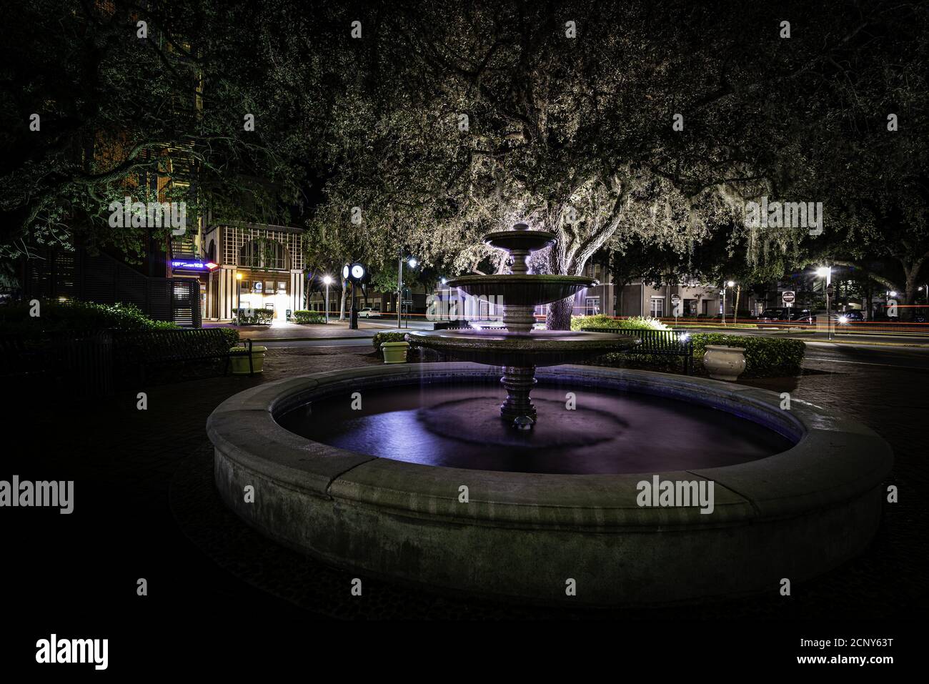 Fountain in a park at night Stock Photo - Alamy