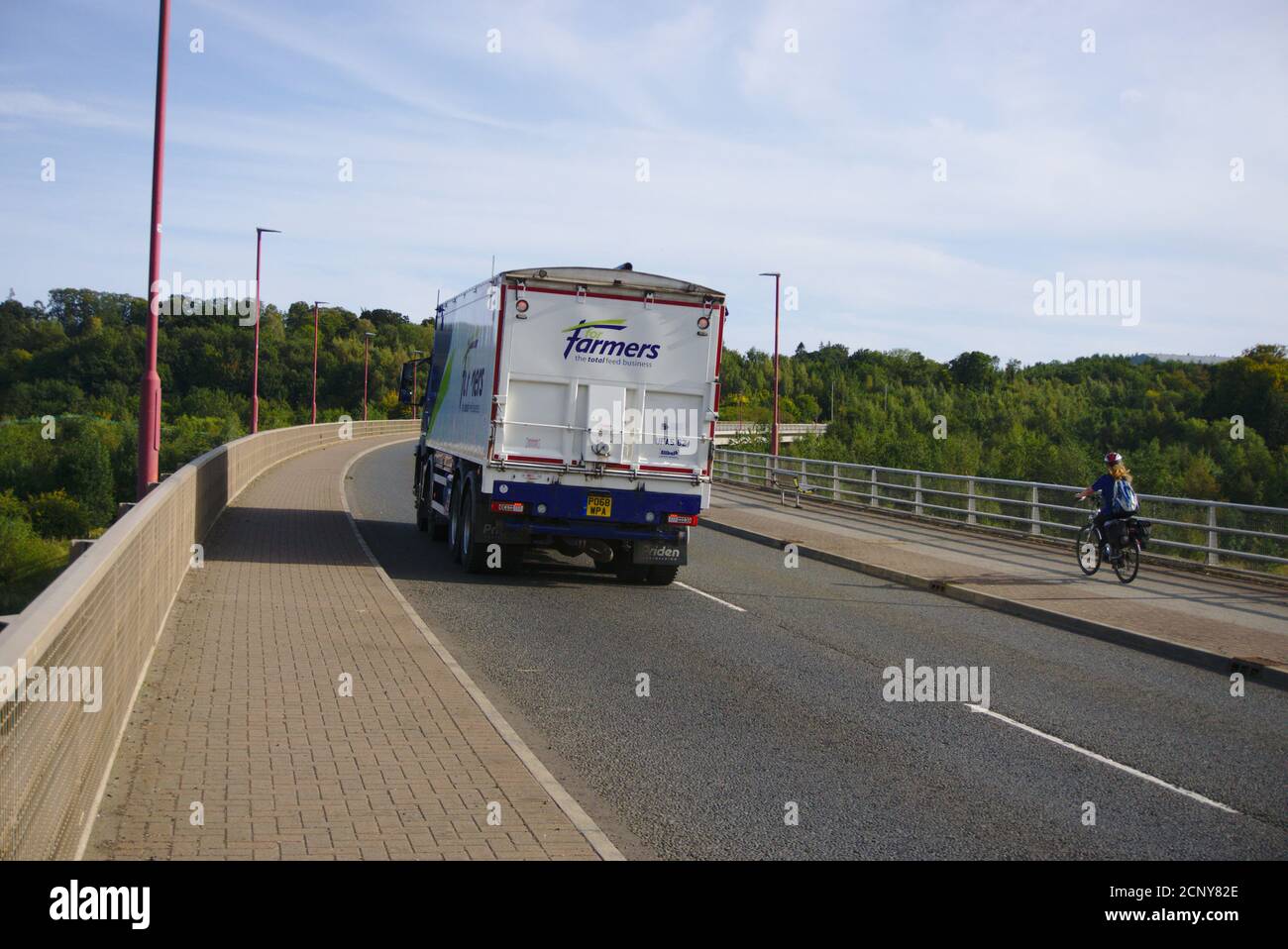 Lorry and cyclist on the A698 crossing the River Tweed at Hunters Bridge on the outskirts of Kelso, Roxburghshire, Scottish Borders, UK. Stock Photo