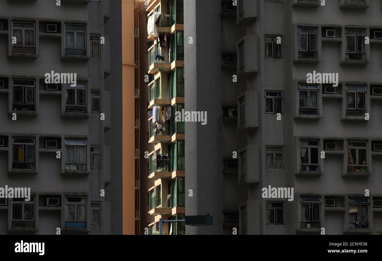 Sunlight hits a private residential building at Ma On Shan in Hong Kong's rural New Territories September 9, 2011.This southern Chinese city is described as a concrete forest, famous for the number of high-rise commercial and residential towers. About 25 percent of the world's tallest 100 residential buildings that stand at least 200 meters tall are in the territory. The world's population is projected to reach seven billion on October 31, according to projections by the United Nations, which says this global milestone presents both an opportunity and a challenge for the planet. While more peo Stock Photo