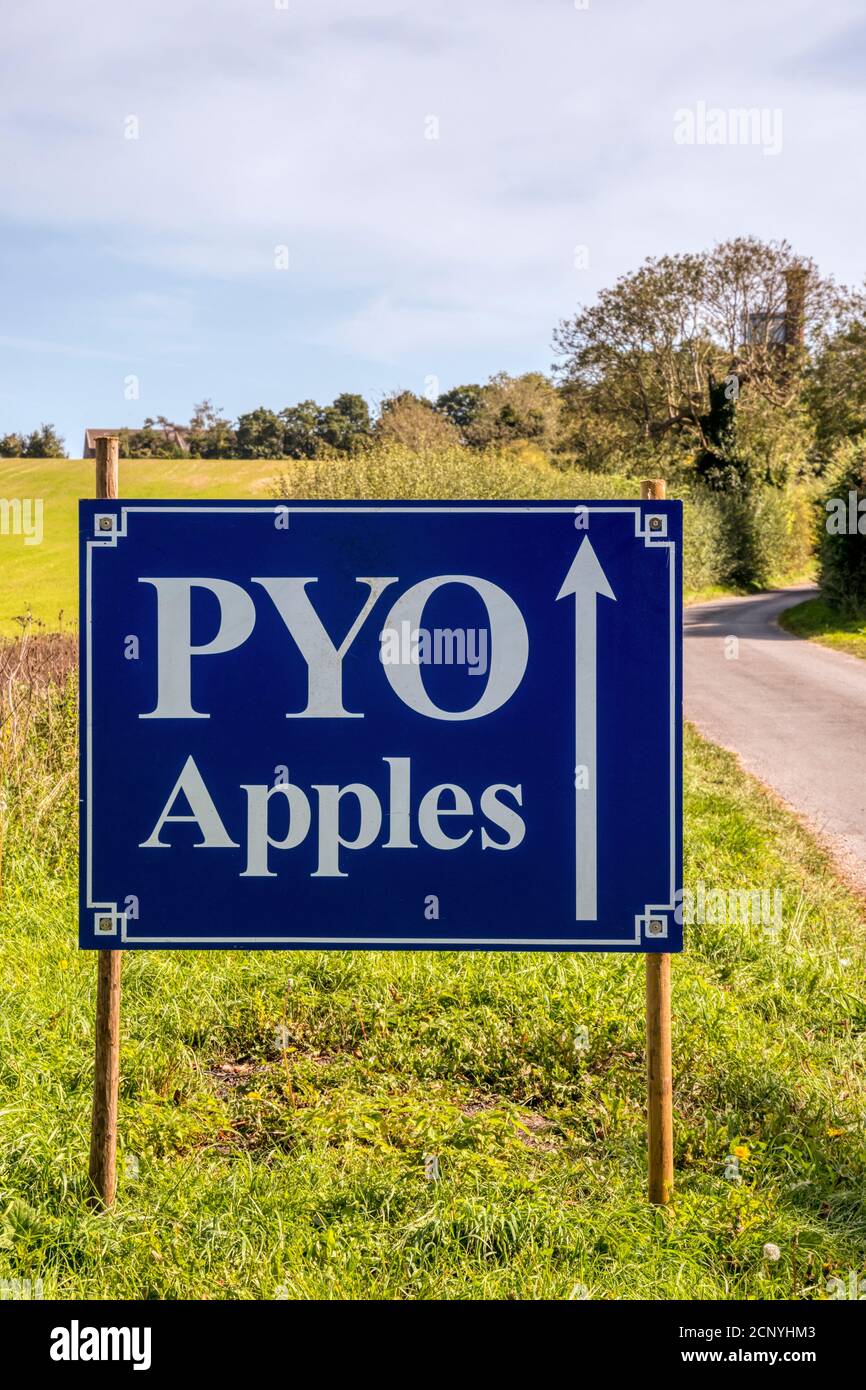 A roadside Pick Your Own Apples sign for the orchards of Royal fruit farms at Sandringham, Norfolk. Stock Photo