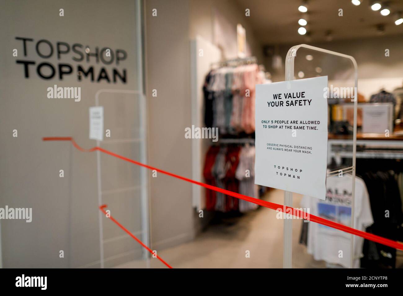 A reminder of safety precautions is posted outside a branch of UK clothing  brand TOPSHOP inside the SM Mall of Asia, amid the coronavirus disease  (COVID-19) outbreak, in Pasay City, Metro Manila,