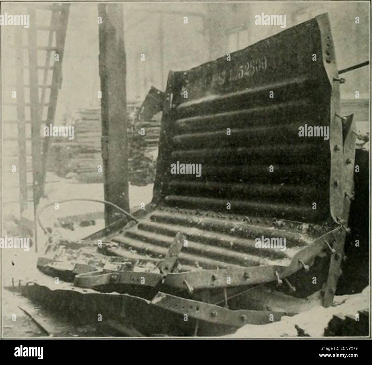 . Railway mechanical engineer . steel Roofed Car After Passing Through Fire ends were the only part of the car that could lie salvaged and,although so badly bent, were sent to the Burnside shopswhere they were received in a condition shown in the firstillustration. These ends were straightened under a press ata total cost of $13.06 and were later applied to an IllinoisCentral box car. The condition of the ends after straighten-. Steel Ends Removed from Destroyed Box Car ing was such as to make them practically as serviceable aswhen new. A similar instance in which a badly damaged steel roof wa Stock Photo