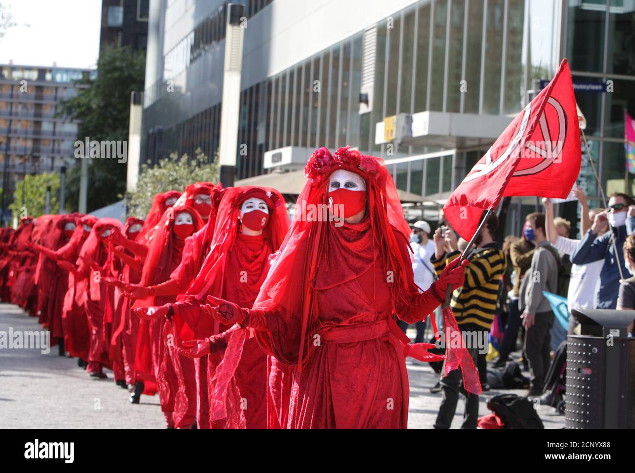 Extinction Rebellions Red Rebell activists performs during protest at the Zuidas financial district amid the Coronavirus pandemic on September 18, 202 Stock Photo