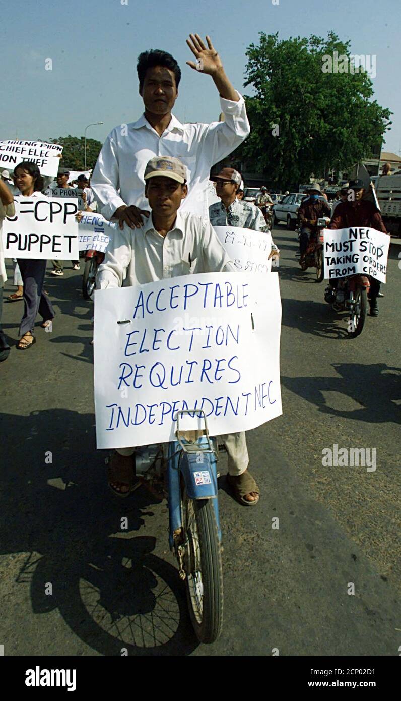 Over 400 supporters of Cambodia's opposition Sam Rainsy Party march through Phnom Penh February 23, 2002 to protest a refusal by authorities to recount votes in several areas following the country's landmark local elections earlier this month. Sam Rainsy, leader of his self-named party, demanded the National Election Committee recount votes declared null and void in six of the 1,621 communes - or clusters of villages - polled on election day, and hold a re-vote in a seventh. Sam Rainsy maintains that recounting spoiled ballot papers would lead to his party's victory in the six contested areas. Stock Photo