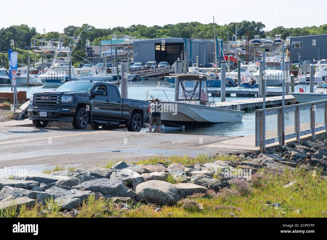 Launching a boat in Sesuit Harbor in Dennis, Massachusetts, USA on Cape