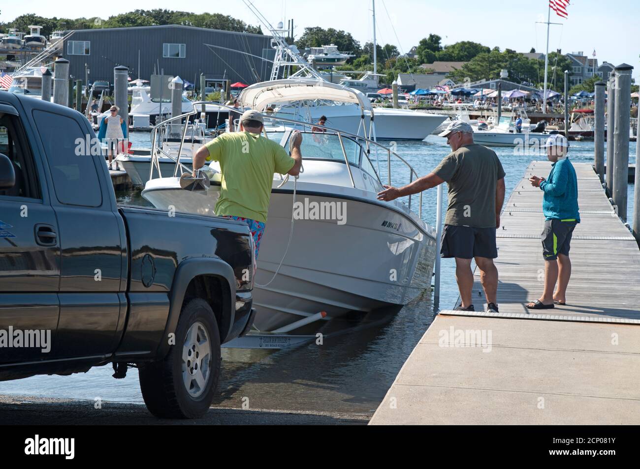 Launching a boat in Sesuit Harbor in Dennis, Massachusetts, USA on Cape