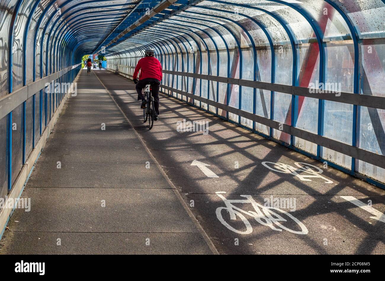 Cycling Infrastructure - covered Cycling and Pedestrian bridge in Cambridge UK. Tony Carter Bridge, a covered cycle bridge, opened 1989. Stock Photo