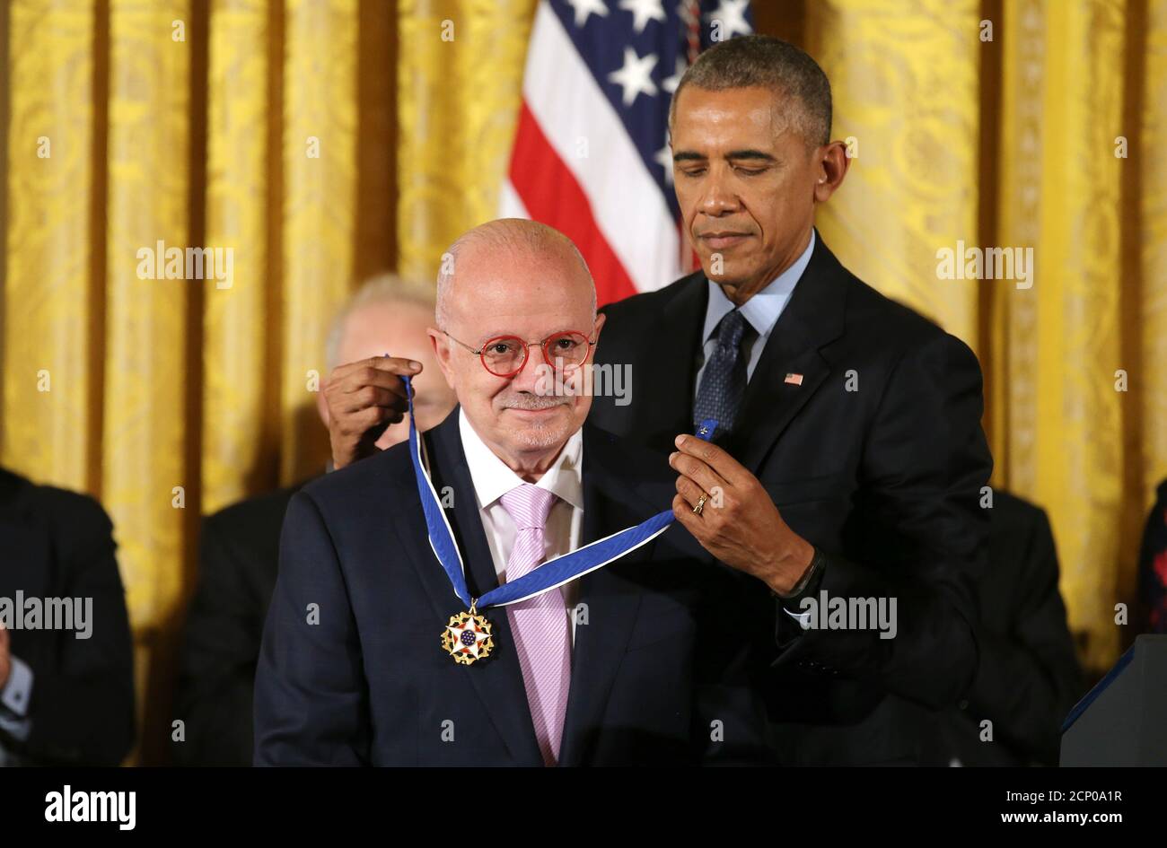 U.S. President Barack Obama awards the President of Miami Dade College Eduardo Padron the Presidential Medal of Freedom during a ceremony in the East Room of  the White House in Washington, U.S., November 22, 2016.        REUTERS/Carlos Barria Stock Photo