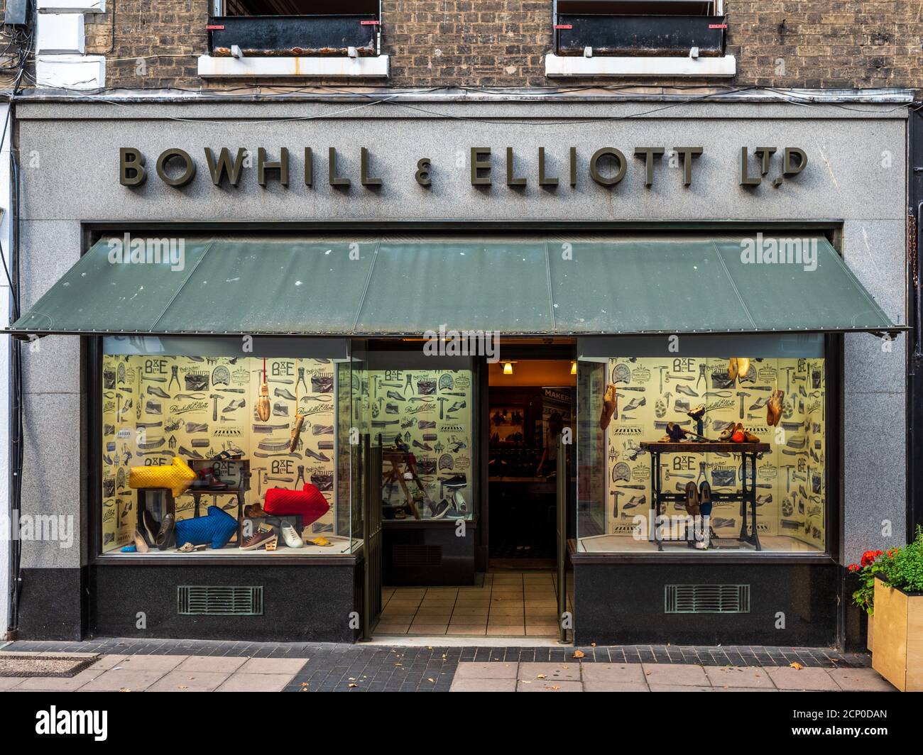 Traditional Shoe Store Norwich UK - Bowhill & Elliott Ltd - formed 1874 the shop has a small shoemaking factory below. Bowhill and Elliott Shoe Shop. Stock Photo